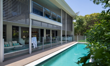 Pool image with house in background at Whitehaven Beach House Coolum holiday homes.