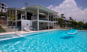Crystal blue water in pool at The Pool House Coolum Beach holiday home rentals.