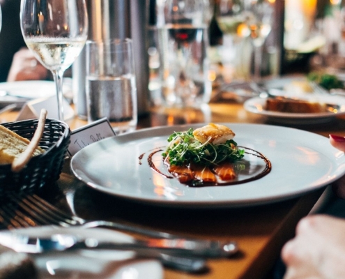 Image of a table set up with a delicious meal | Featured image for fine dining Sunshine Coast blog.