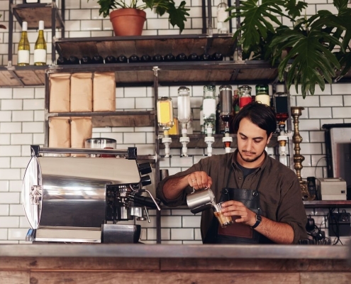 Barista pouring coffee | Featured image for Best Cafes Sunshine Coast - Our Top Picks | Blog